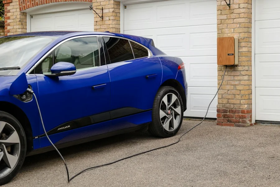Electric vehicle connected to a residential wall-mounted charging station